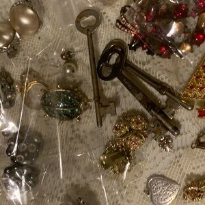 Jewelers Gold and Silver pieces gems, beads,and misc pieces.over 50+ items.